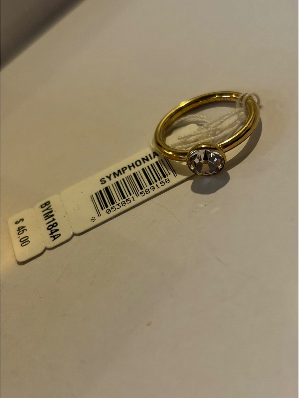 Symphonic Gold tone solitaire ring